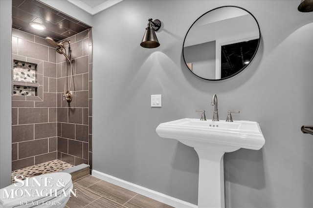 1319 S River Pointe Dr, Saint Clair, MI 48079 - full bathroom featuring a tile shower and baseboards