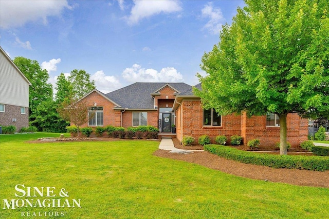 1319 S River Pointe Dr, Saint Clair, MI 48079 - view of front of house with brick siding and a front yard