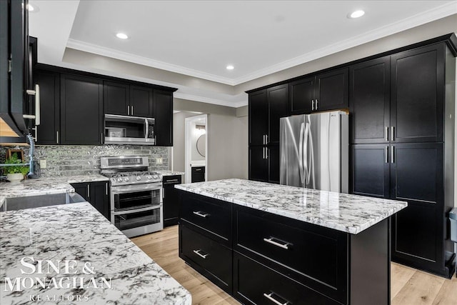 1319 S River Pointe Dr, Saint Clair, MI 48079 - kitchen featuring dark cabinets, appliances with stainless steel finishes, light stone countertops, decorative backsplash, and crown molding
