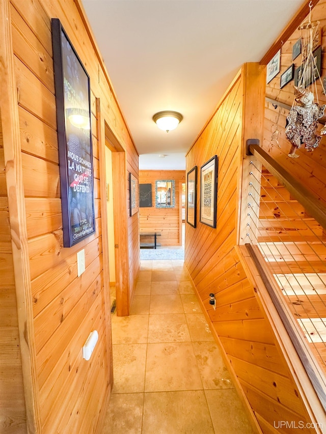 273 N Basin Dr, Negaunee, MI 49866 - hallway with wood walls and light tile patterned flooring