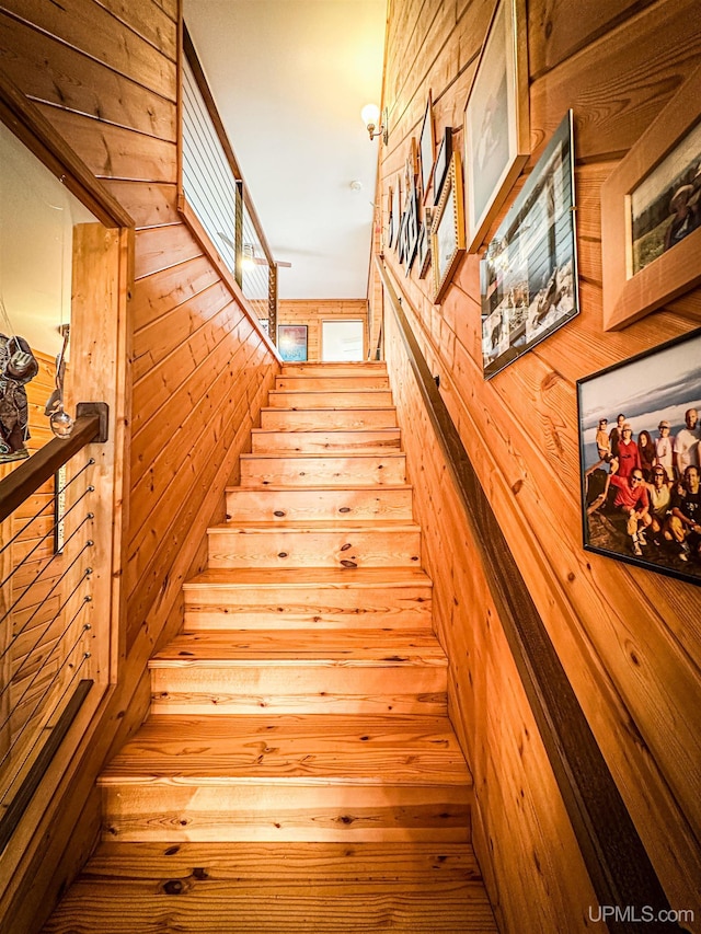 273 N Basin Dr, Negaunee, MI 49866 - stairway featuring wood walls