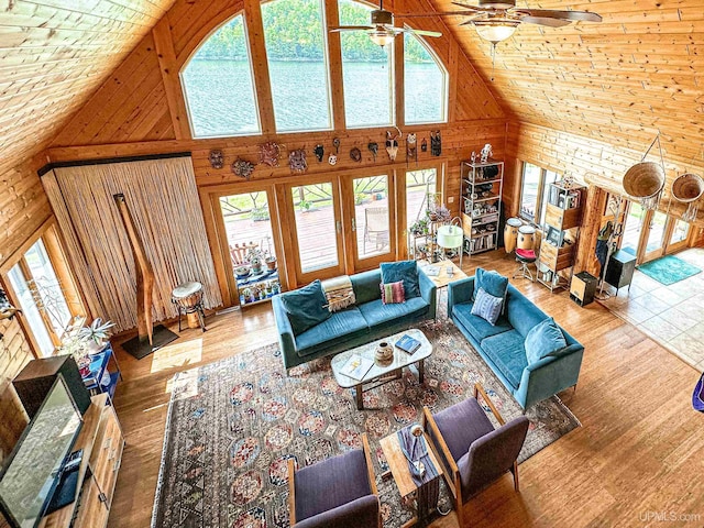 273 N Basin Dr, Negaunee, MI 49866 - living area featuring high vaulted ceiling, wood walls, ceiling fan, wood finished floors, and wood ceiling