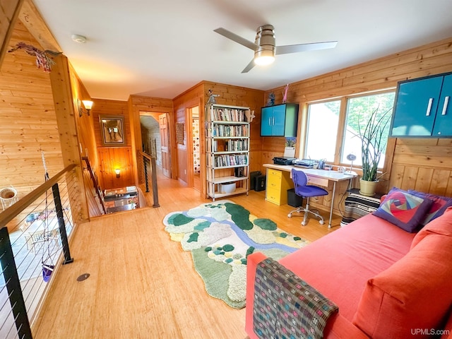 273 N Basin Dr, Negaunee, MI 49866 - home office featuring wooden walls, ceiling fan, and wood finished floors