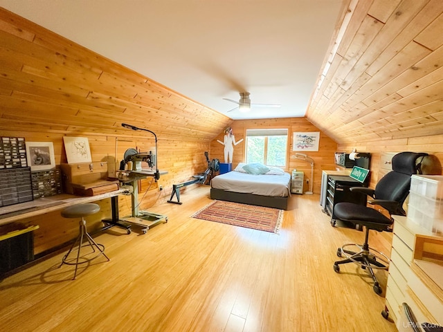 273 N Basin Dr, Negaunee, MI 49866 - bedroom featuring wood walls, wood finished floors, and vaulted ceiling