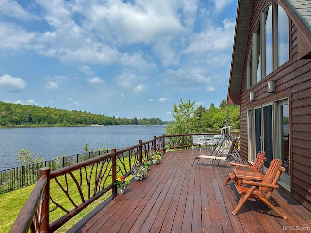 273 N Basin Dr, Negaunee, MI 49866 - wooden deck featuring a water view