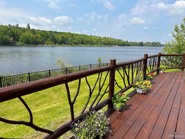 273 N Basin Dr, Negaunee, MI 49866 - wooden terrace with a water view and a fenced backyard