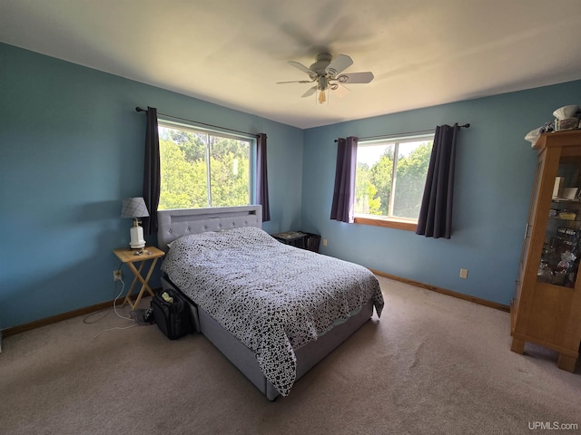 49962 Rosenlund Rd, Hancock, MI 49930 - carpeted bedroom with multiple windows and a ceiling fan