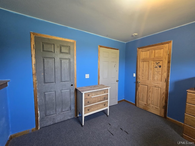 49962 Rosenlund Rd, Hancock, MI 49930 - bedroom featuring dark carpet and baseboards