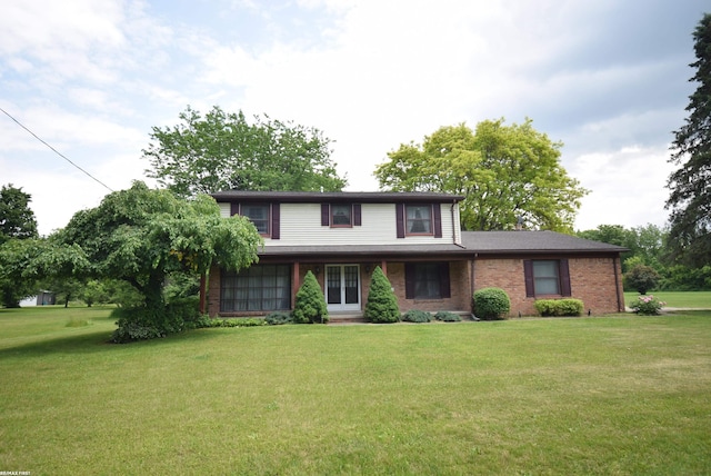 71800 Coon Creek Rd, Armada, MI 48005 - traditional home featuring a front yard and brick siding