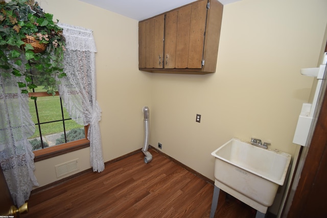 71800 Coon Creek Rd, Armada, MI 48005 - washroom with dark wood-style floors and baseboards