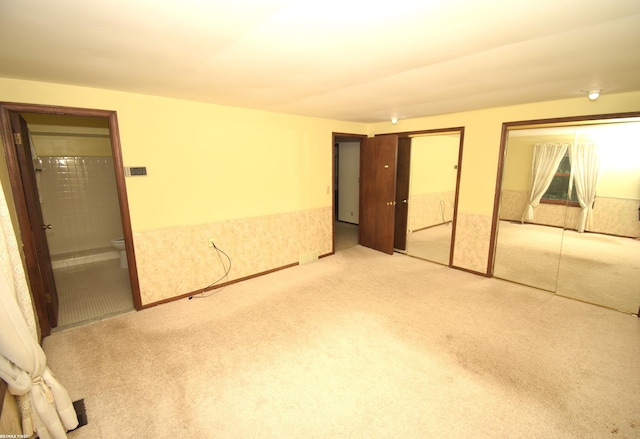 71800 Coon Creek Rd, Armada, MI 48005 - unfurnished bedroom with multiple closets, carpet floors, and connected bathroom