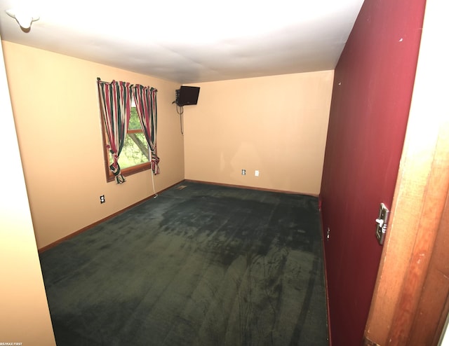 71800 Coon Creek Rd, Armada, MI 48005 - unfurnished room featuring baseboards and dark carpet