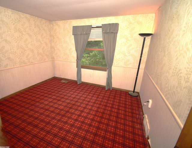 71800 Coon Creek Rd, Armada, MI 48005 - spare room with wallpapered walls and a wainscoted wall