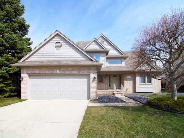 20343 Nicol Creek Dr, Macomb Twp, MI 48044 - view of front facade with brick siding, driveway, a garage, and a front yard