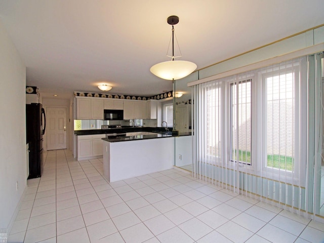 20343 Nicol Creek Dr, Macomb Twp, MI 48044 - kitchen with black appliances, dark countertops, light tile patterned flooring, pendant lighting, and white cabinets