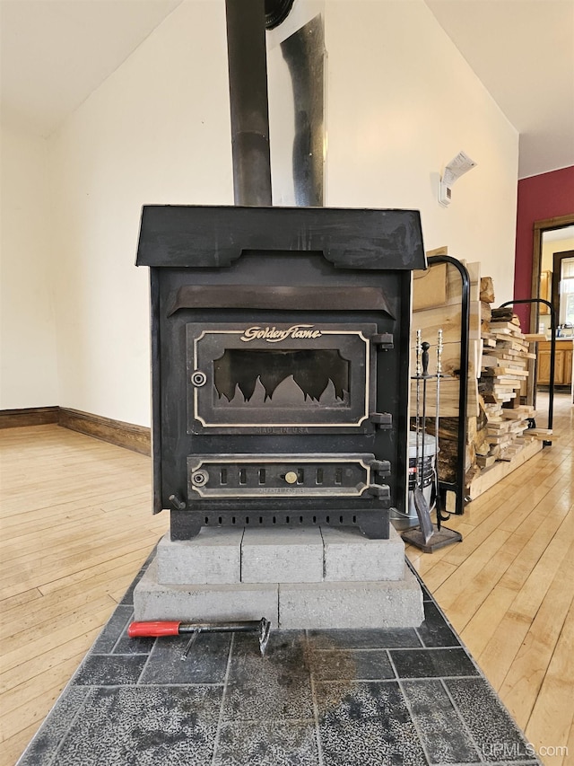 52377 Duncan Ave, Hubbell, MI 49934 - detailed view of a wood stove and wood finished floors