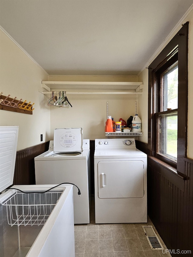 52377 Duncan Ave, Hubbell, MI 49934 - laundry room with separate washer and dryer, ornamental molding, tile patterned floors, and a wainscoted wall