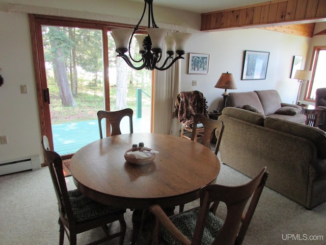 20517 Park Rd, Skanee, MI 49962 - dining area featuring light carpet, a chandelier, and a baseboard heating unit