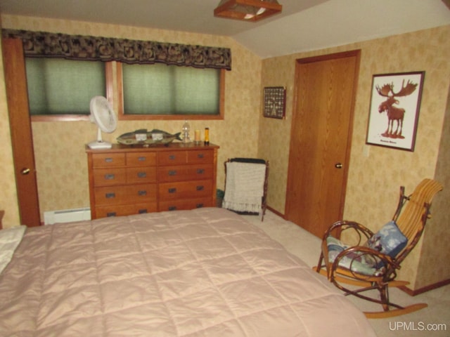 20517 Park Rd, Skanee, MI 49962 - bedroom featuring wallpapered walls, a baseboard radiator, lofted ceiling, and carpet