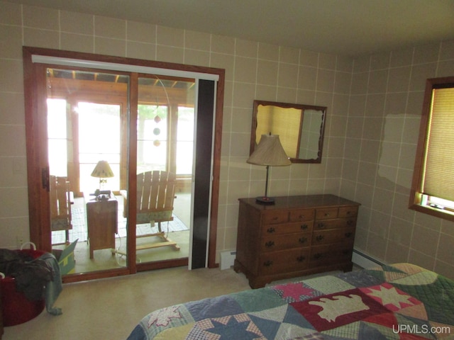 20517 Park Rd, Skanee, MI 49962 - bedroom featuring tile walls, a baseboard radiator, and carpet