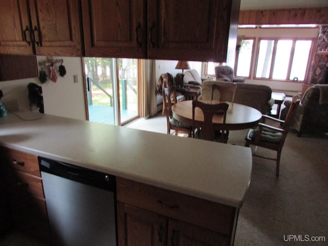 20517 Park Rd, Skanee, MI 49962 - kitchen with stainless steel dishwasher, light countertops, light colored carpet, and open floor plan