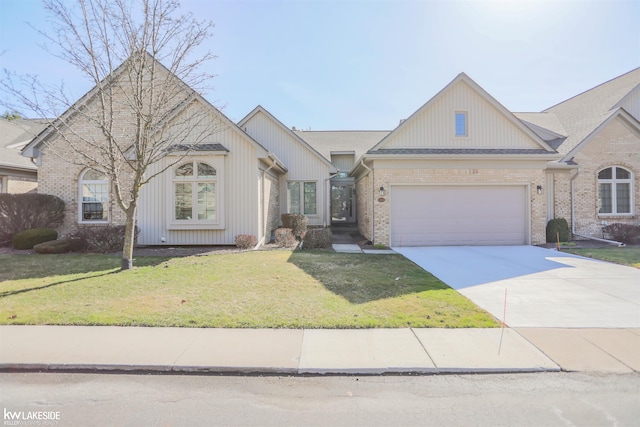 54826 Cambridge Dr, Shelby, MI 48315 - view of front of house with concrete driveway, an attached garage, a front lawn, and brick siding