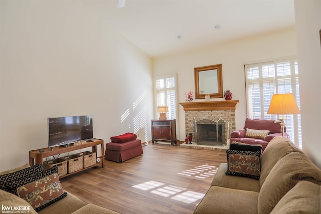 54826 Cambridge Dr, Shelby, MI 48315 - living area with wood finished floors and a brick fireplace