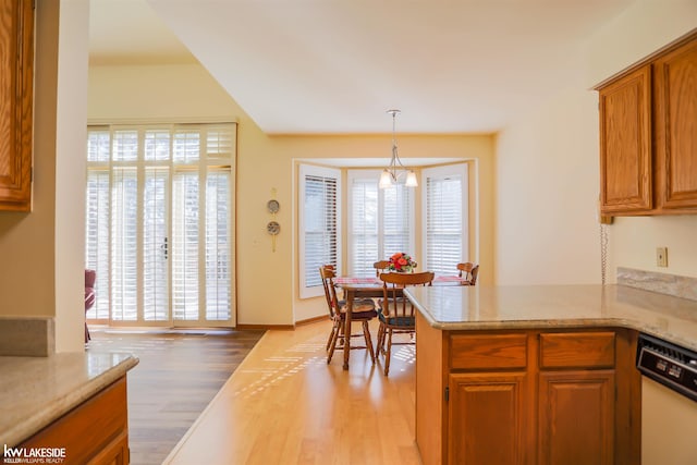 54826 Cambridge Dr, Shelby, MI 48315 - kitchen featuring dishwasher, light wood-type flooring, healthy amount of natural light, and brown cabinets