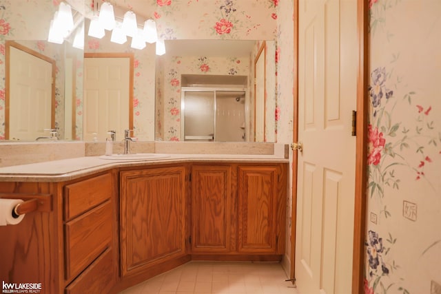 54826 Cambridge Dr, Shelby, MI 48315 - full bathroom featuring wallpapered walls, vanity, a shower stall, and tile patterned flooring