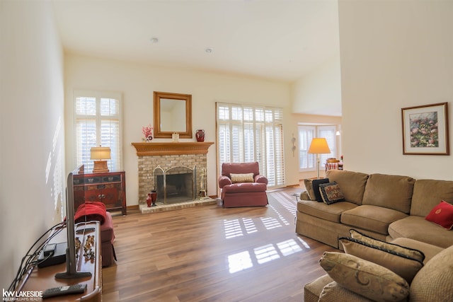 54826 Cambridge Dr, Shelby, MI 48315 - living area with healthy amount of natural light, wood finished floors, and a fireplace