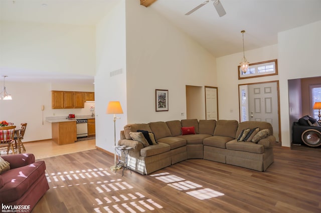 54826 Cambridge Dr, Shelby, MI 48315 - living area featuring high vaulted ceiling, light wood-style floors, and a ceiling fan