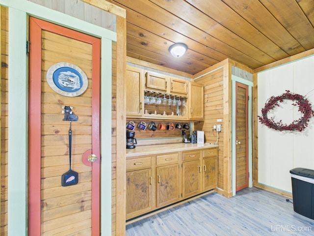 10031 N Ross Lake Rd, Shingleton, MI 49884 - bar area featuring wood ceiling, light wood-style flooring, and wooden walls