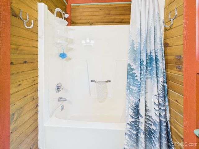 10031 N Ross Lake Rd, Shingleton, MI 49884 - bathroom featuring shower / bath combination with curtain and wood walls