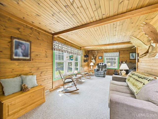 10031 N Ross Lake Rd, Shingleton, MI 49884 - living room with wood walls, carpet, and a wood ceiling with exposed beams