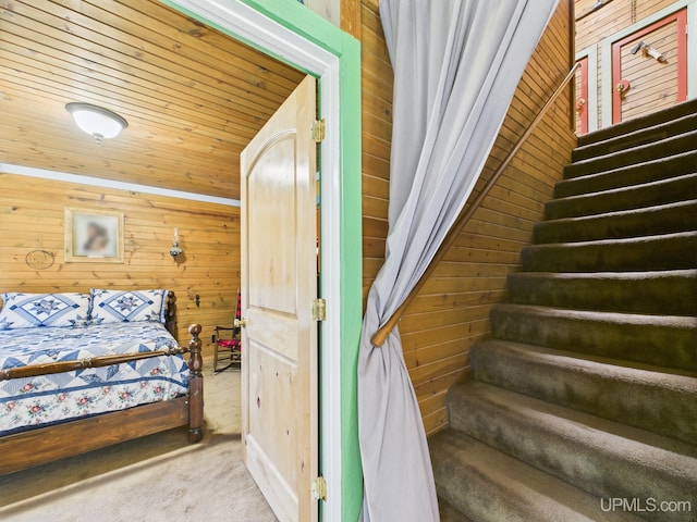 10031 N Ross Lake Rd, Shingleton, MI 49884 - carpeted bedroom with wooden walls
