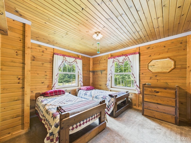 10031 N Ross Lake Rd, Shingleton, MI 49884 - bedroom with wood ceiling, wooden walls, and carpet flooring