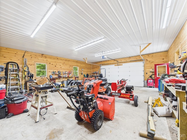 10031 N Ross Lake Rd, Shingleton, MI 49884 - garage featuring wooden walls and a workshop area