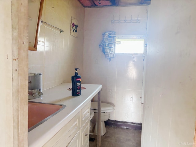 345 N Maple St, Manistique, MI 49854 - half bath with tile walls and vanity