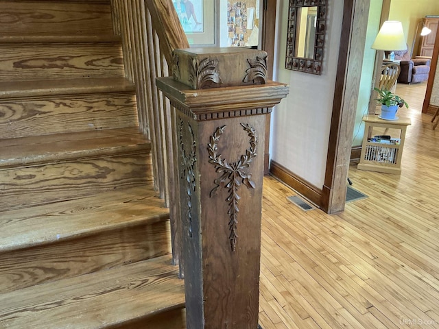 232 Winberg Rd, Skandia, MI 49885 - stairs featuring baseboards and wood finished floors
