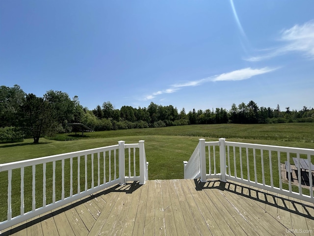232 Winberg Rd, Skandia, MI 49885 - wooden terrace with a lawn