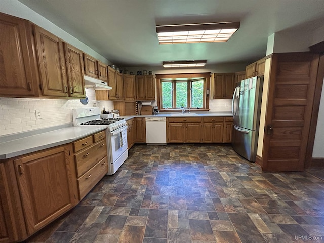 232 Winberg Rd, Skandia, MI 49885 - kitchen with white appliances, under cabinet range hood, backsplash, and light countertops