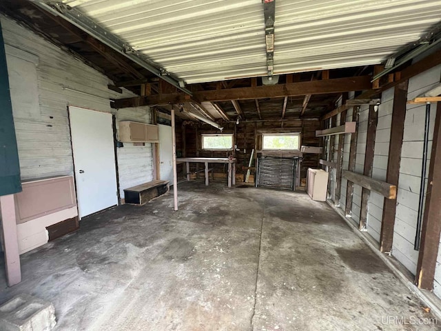 228 Schoolcraft Ave, Manistique, MI 49854 - garage featuring wooden walls