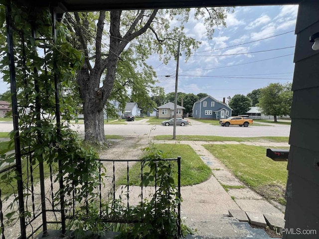 228 Schoolcraft Ave, Manistique, MI 49854 - view of yard featuring a residential view
