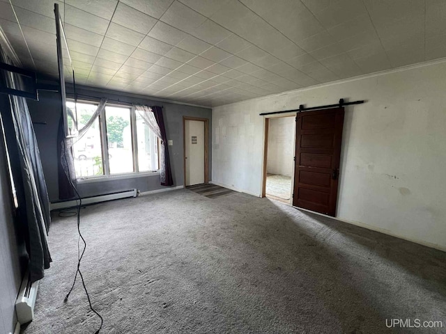 228 Schoolcraft Ave, Manistique, MI 49854 - empty room featuring a barn door, a baseboard radiator, crown molding, and carpet floors