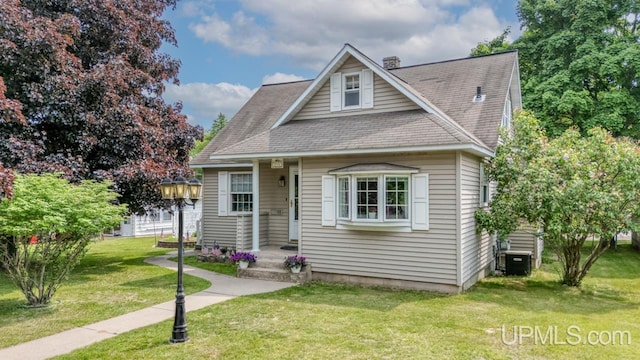 216 Mine St, Norway, MI 49870 - bungalow-style home featuring a front yard and a shingled roof