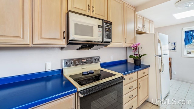 216 Mine St, Norway, MI 49870 - kitchen featuring white appliances, light brown cabinets, light tile patterned floors, and dark countertops