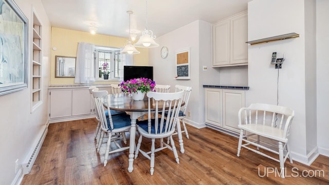 216 Mine St, Norway, MI 49870 - dining space featuring baseboard heating and wood finished floors