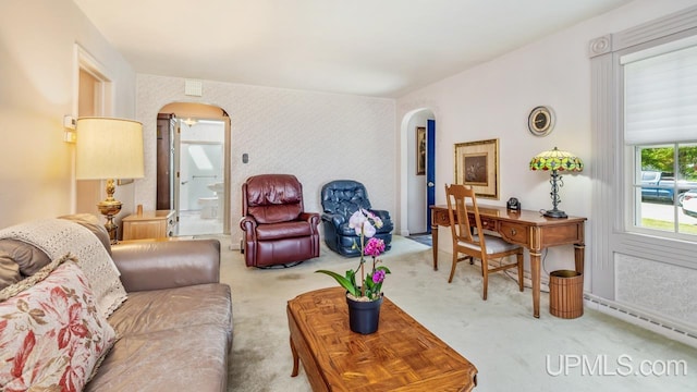 216 Mine St, Norway, MI 49870 - living area with arched walkways and carpet
