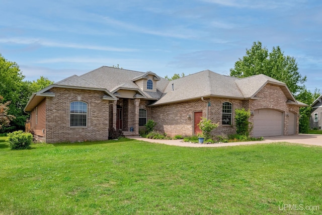 821 Camelot Dr, Negaunee, MI 49866 - french provincial home featuring brick siding, driveway, a front yard, a garage, and a shingled roof