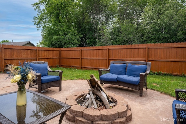 821 Camelot Dr, Negaunee, MI 49866 - fenced backyard with a patio area and an outdoor living space with a fire pit